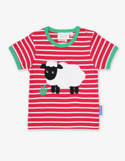 Vaikiški marškinėliai trumpomis rankovėmis. Su žaisminga avytės aplikacija ir kontrastingomis, žaliomis detalėmis.