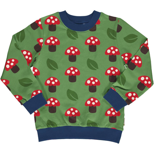Vaikiškas džemperis iš GOTS sertifikuotos organinės medvilnės. Ryškiai žalios spalvos, margintas raudonais grybukais. 